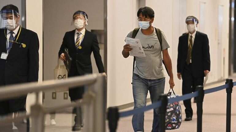 Japanese journalist held in Myanmar arrives in Tokyo