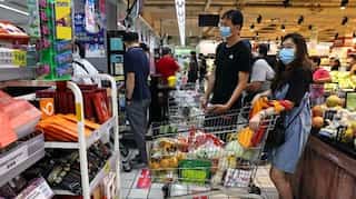 Taiwan discourages people from panic buying as Covid restrictions come into force