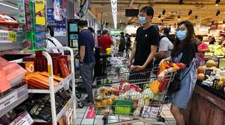 Taiwan discourages people from panic buying as Covid restrictions come into force