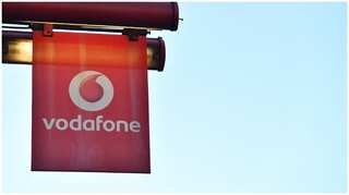 Vodafone edges back into annual profit