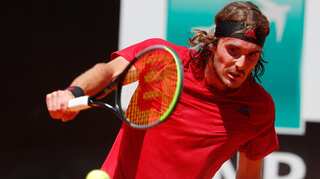 Tennis: Steely Tsitsipas keeps cool to beat Isner in four sets in Roland Garros
