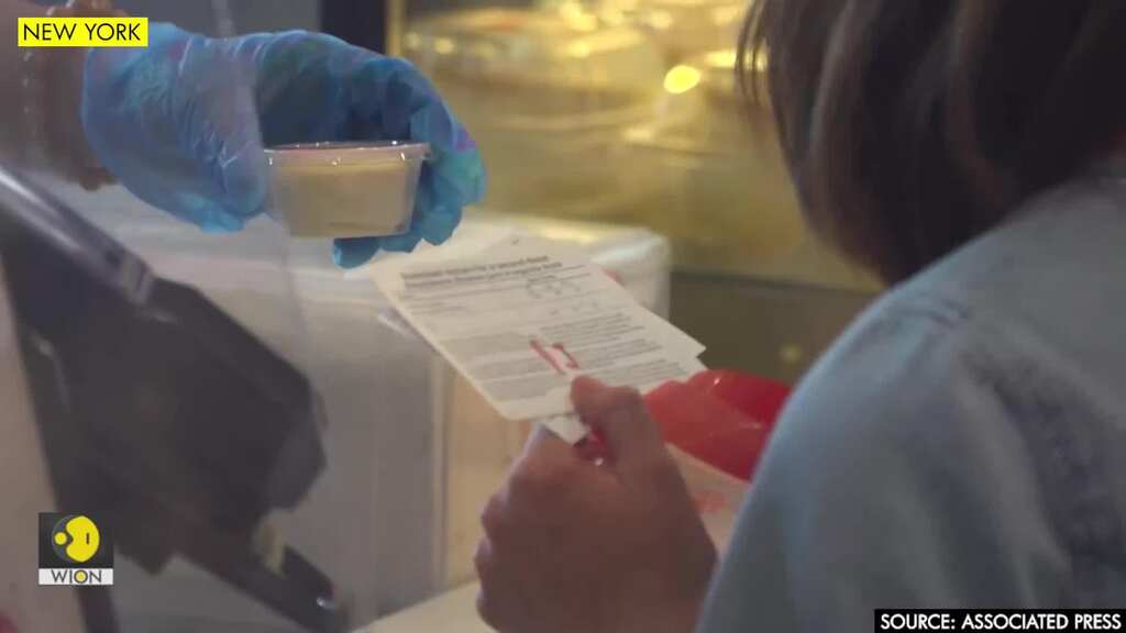New Yorkers flash vaccine card for freebies