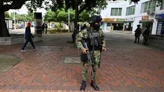 In Colombia, protesters march on as talks stall and blockades remain