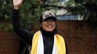 'Aim high': Hong Kong teacher sets record for fastest Everest climb