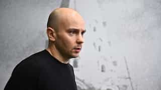 Russian activist has home raided after being hauled off plane