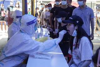 China returns to its strict Covid limits to fight a new outbreak