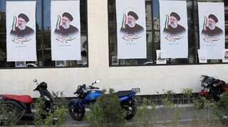 Iran struggles through economic pain as presidential vote nears