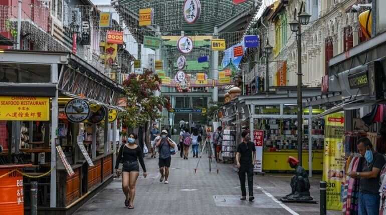 Singapore to ease curbs as virus cases fall
