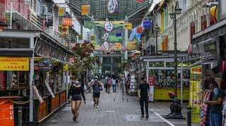 Singapore to ease curbs as virus cases fall