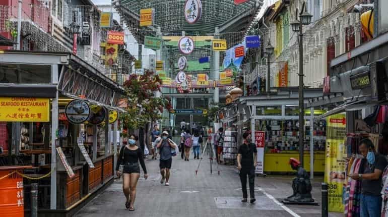 Singapore to ease curbs as virus cases fall