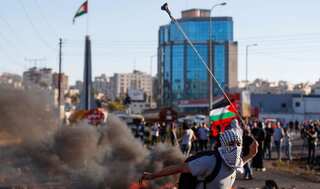 Tyres, fires, lasers: Palestinians smoke out settlers