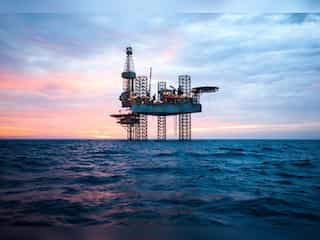 Oil slips again on surging US dollar