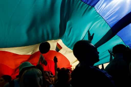 March under the rainbow coloured flag