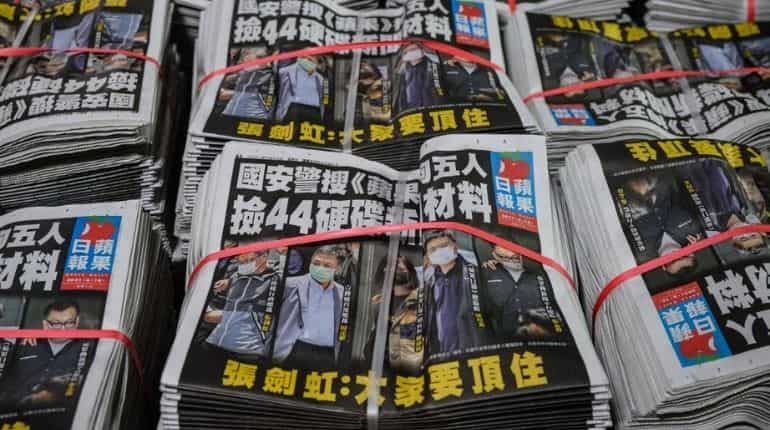 Under pressure, Hong Kong's pro-democracy publication Apple Daily announces closure