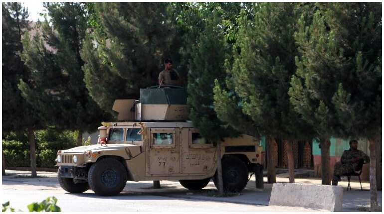Fear in northern Afghan city as Taliban lay siege