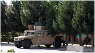 Fear in northern Afghan city as Taliban lay siege