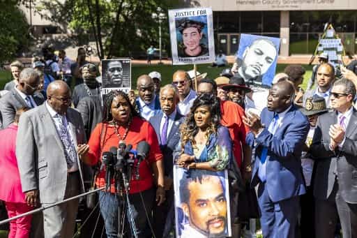 Nekima Levy Armstrong flanked by Floyd Family