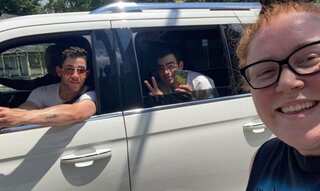 Nick Jonas surprises a fan wearing a Jonas Brothers tee on the street