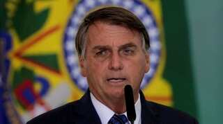 As calls grow for his impeachment, Bolsonaro fires official over graft claims