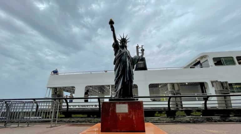 Mini Statue of Liberty on loan from France joins original in New York Harbour