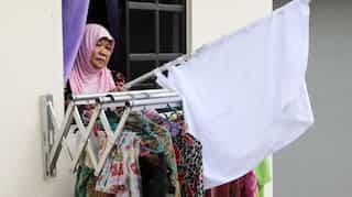 Malaysians turn to white flags to seek help as lockdown torments