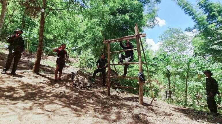Myanmar rebel group suspends key leader in massacre investigation