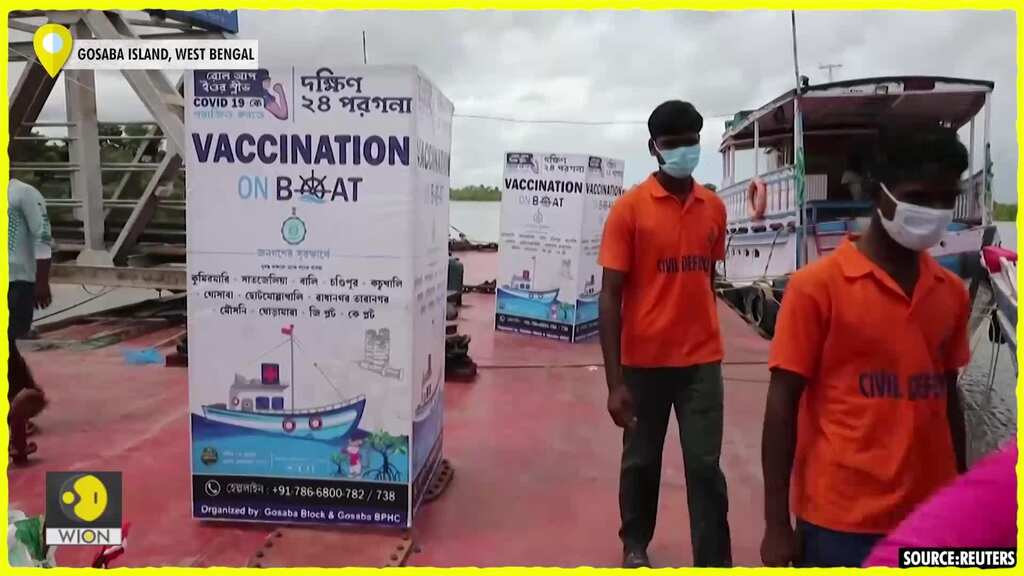 Health workers travel by boat to vaccinate people in West Bengal