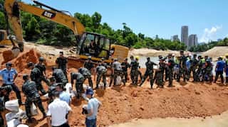 Chinese workers trapped in flooded highway tunnel for second day