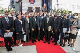 Roiled by presidential assassination, Haiti swears in new PM