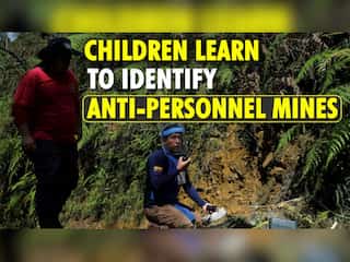 Colombian children learn to identify landmines buried during their country's long civil war