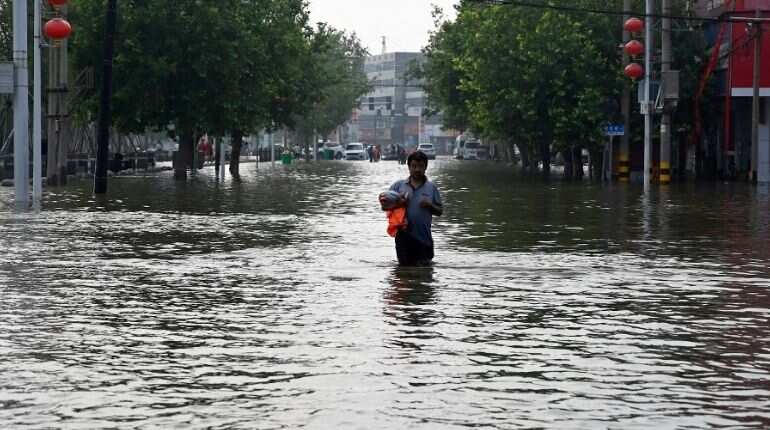China floods: Mother dies saving baby from mudslide in Henan