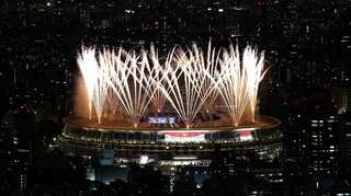 Olympics-Fireworks get Tokyo's no-frills opening ceremony underway