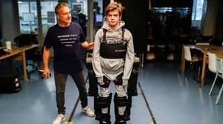 French father builds voice-controlled exoskeleton to help his wheelchair-bound son walk