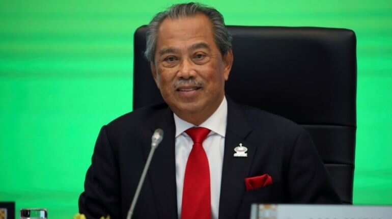 Malaysia's prime minister quits, to take up caretaker role