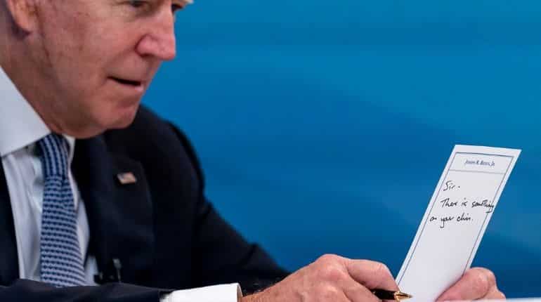 Watch: ‘Sir, there is something on your chin’ — Biden accidentally reveals staff note