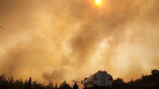 Turkey and Greece reel from raging wildfires during heatwave