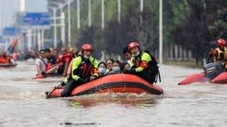 Corpses afloat in car parks, tunnel: China floods death toll rises to 302