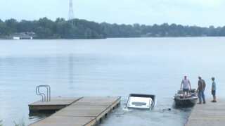 Watch: Parked car slips into water during live TV coverage