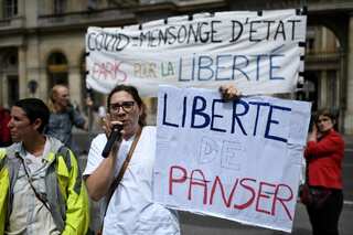 Despite protests, France to implement Macron's COVID-19 pass from today