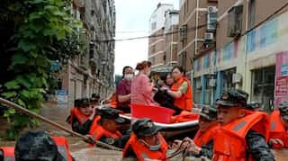'Red alert' for rain declared in China as flood death toll hits 21