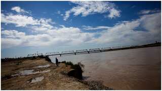 An iconic bridge sees US allies flee Afghanistan as Soviets did