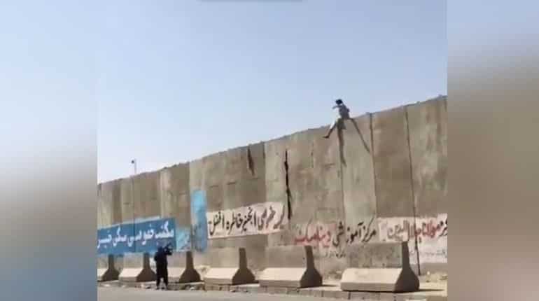 WATCH : Civilian trying to enter Kabul airport shot at amid chaos in Afghanistan WATCH : Civilian trying to enter Kabul airport shot at amid chaos in Afghanistan