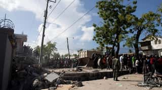 Storm brings floods as Haitians seek help at overloaded hospitals after quake