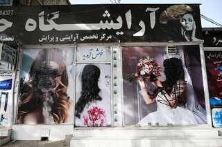 See pics: Women's poster defaced in Kabul as Taliban consolidates hold over Afghanistan
