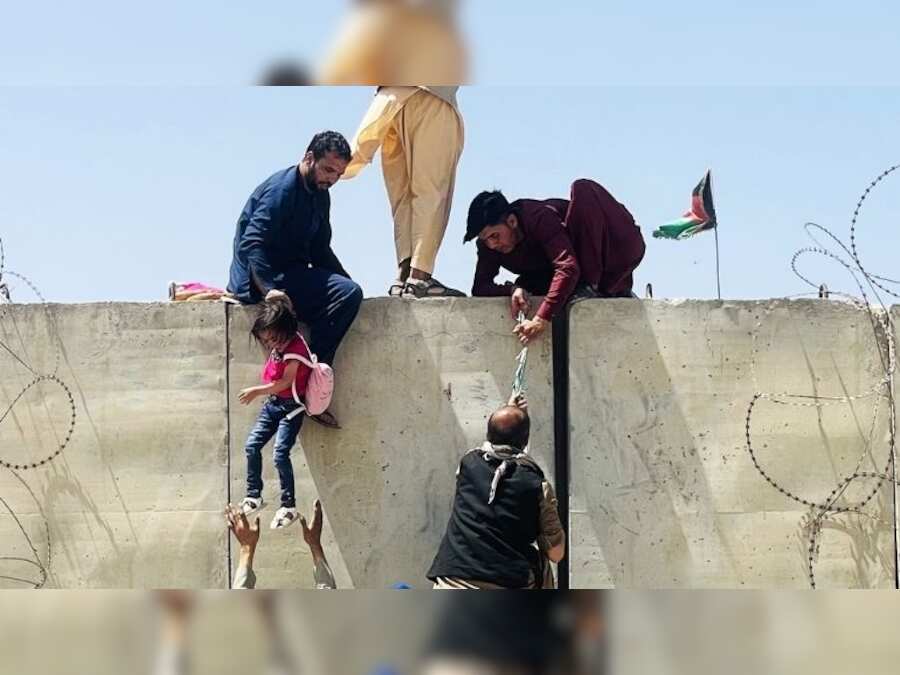 Heartbreaking: Desperate Afghan mothers throw children over Kabul airport fence in bid to escape Taliban