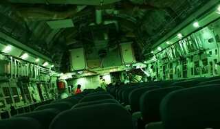 Nick of time: Ex-UK commando evacuates wife in nearly empty plane as thousands struggle to flee Afghanistan