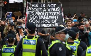 Hundreds of anti-lockdown protesters arrested in Australia as daily cases hit record high