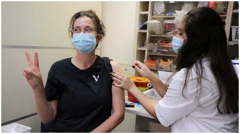More than 1 million Israelis who haven’t gotten booster will lose quarantine exemption