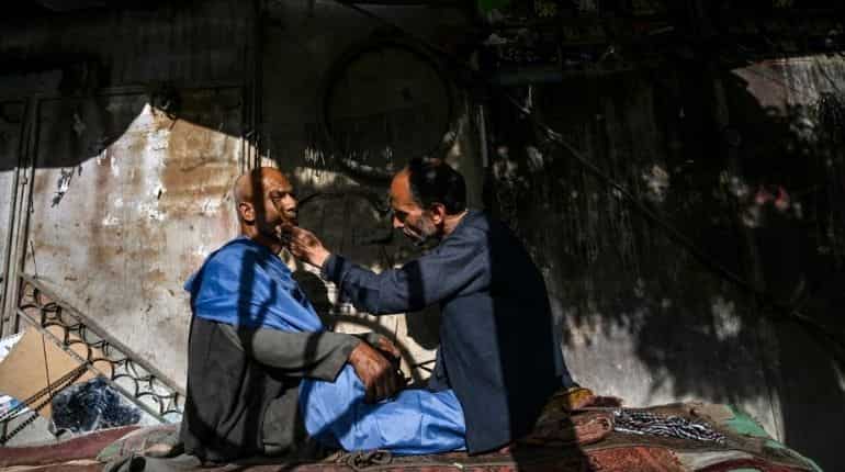 Kabul barber fears uncertain future under Taliban rule while residents hope for jobs Kabul barber fears uncertain future under Taliban rule while residents hope for jobs