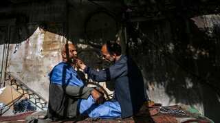 Kabul barber fears uncertain future under Taliban rule while residents hope for jobs